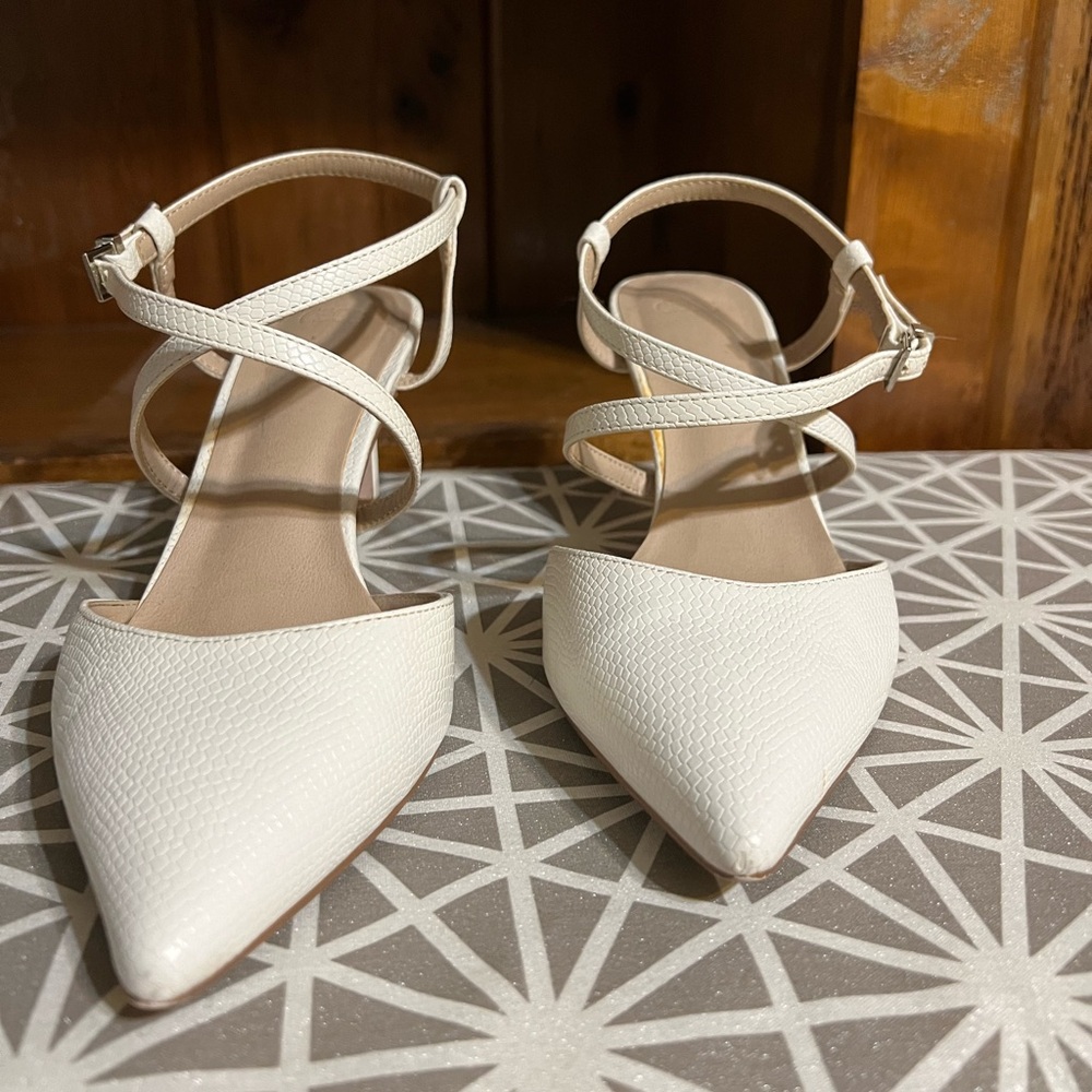 Strappy low white heels